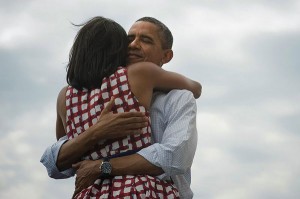 Barack Obama hugs Michelle Obama